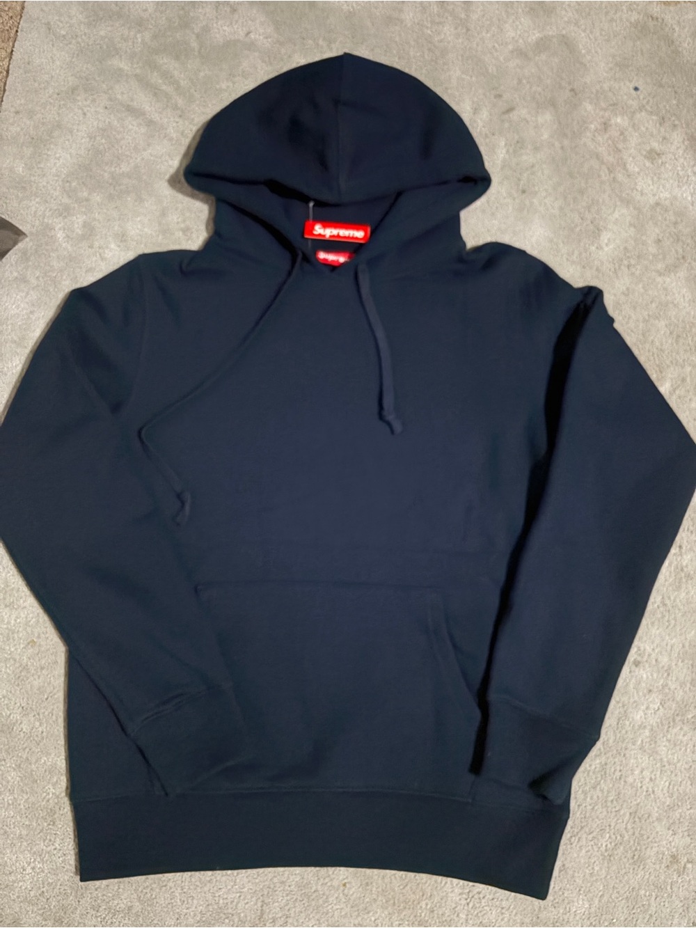 Supreme Navy Pullover Hoodie with Red Logo Tag
